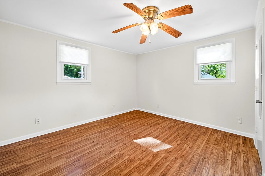 Good sized rear bedroom with Queen sized bed, dresser, desk. 