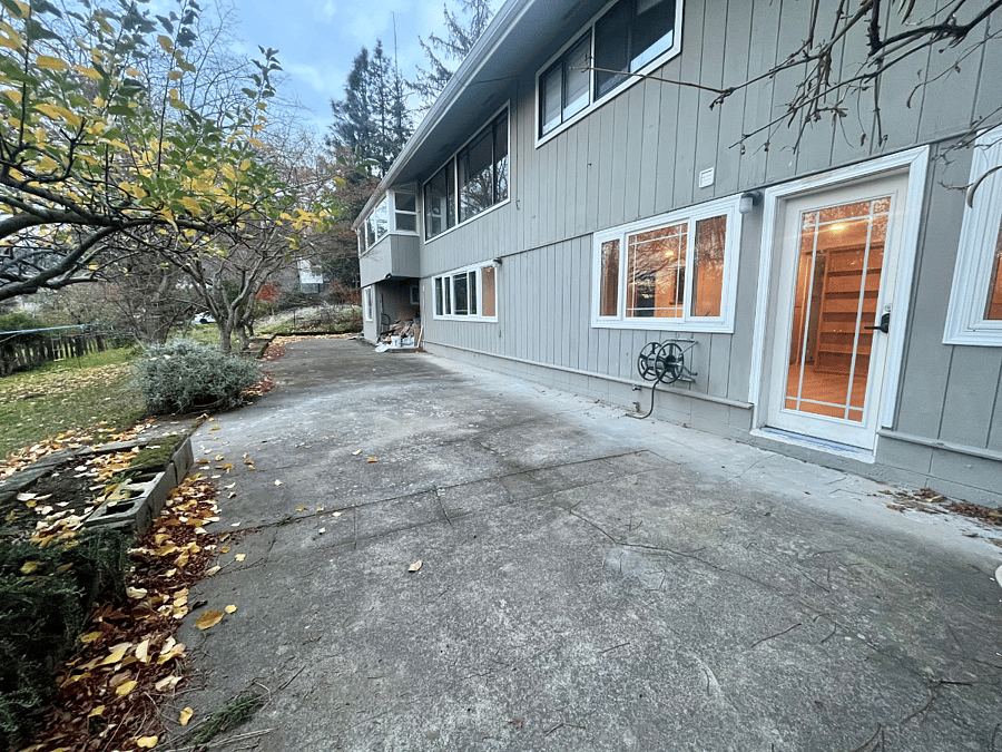 Exterior Photo showing Private Front Entrance, Covered Outdoor Patio and (part of) shared Backyard