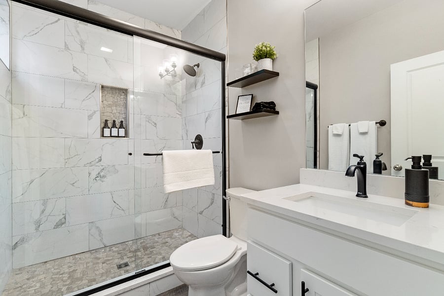 A bright, modern ensuite bathroom with a spacious walk-in shower and sleek finishesoffering a clean, comfortable start and end to each day