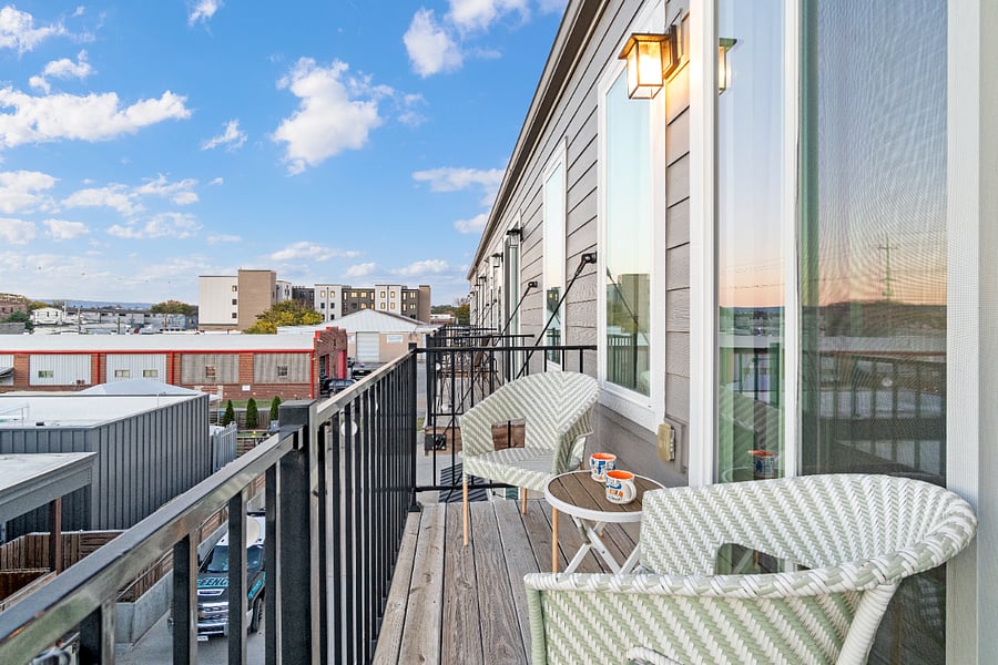A private balcony off the king-sized bedroom, perfect for enjoying your morning coffee while taking in the hustle and bustle of Chattanoogas vibrant Southside