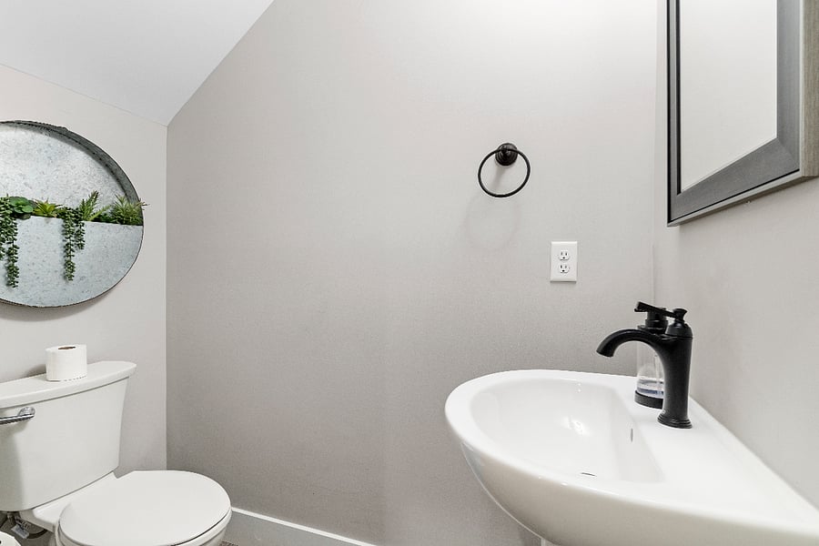 A clean and convenient half bathroom on the main levelperfect for guests and everyday ease during longer stays