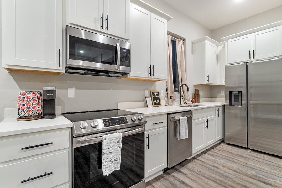 A modern, fully equipped kitchen with stainless-steel appliances and plenty of counter spaceideal for comfortable long-term cooking and daily living