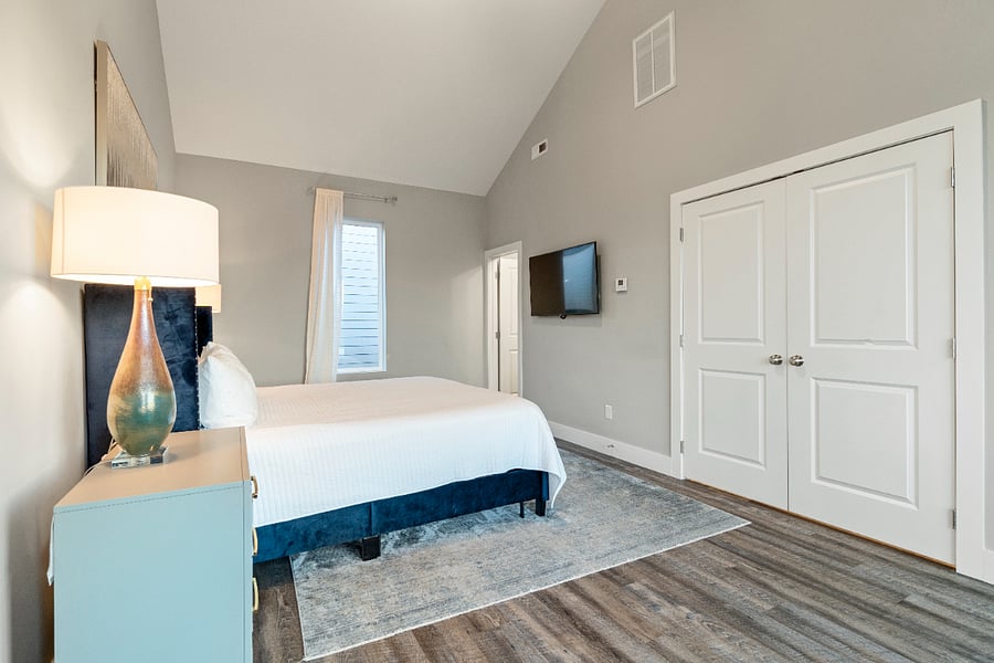 A spacious primary bedroom with a king-sized bed, ample storage, and a clean modern designideal for settling in during a mid-term stay