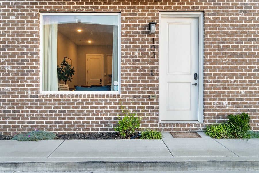 A welcoming front entrance with charming brick exterior, offering easy access and a warm first impression for your Southside stay