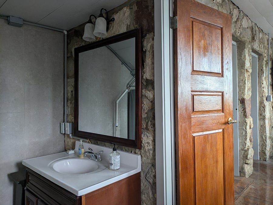 Typical of 100 year old homes, the bathroom has one step down, not handicap accessible
but grab bars in tub/shower .