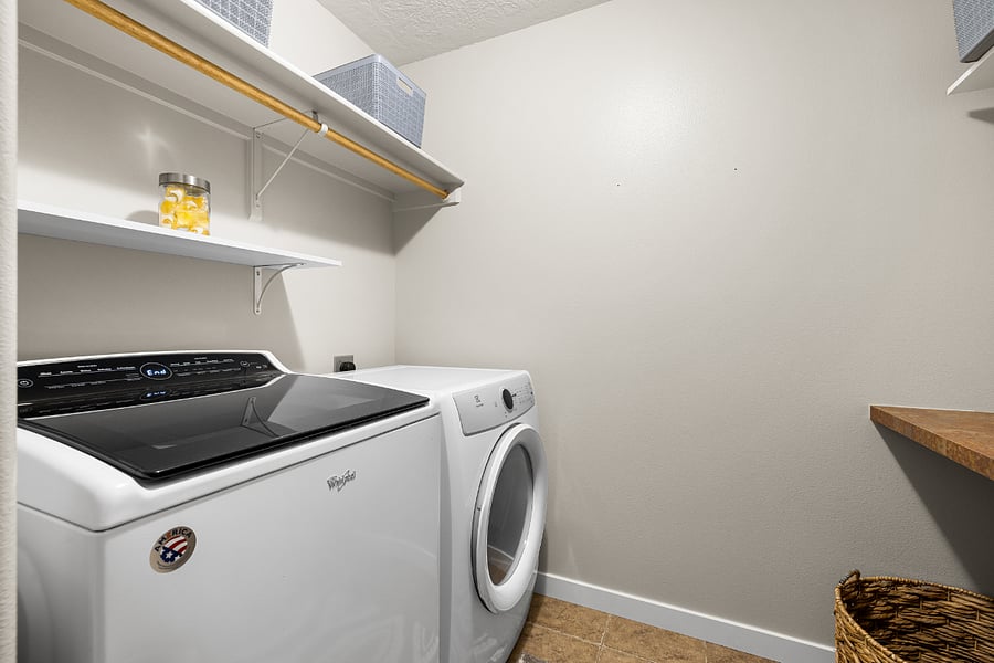 Main floor laundry. Starter kid of Tide unscented pods, unscented dryer sheets, and scented laundry beads provided.