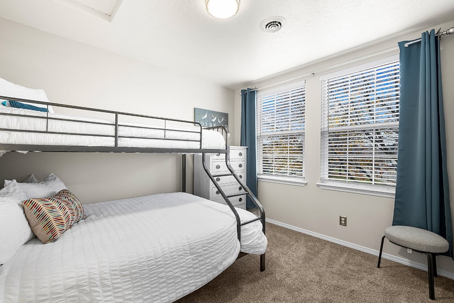 Cooling Tuft & Needle Twin XL over Luxury Saatva Queen in the adult worthy, but kid friendly upstairs bedroom. Closet, hangers, hamper, dresser, luggage rack, and blackout curtains.