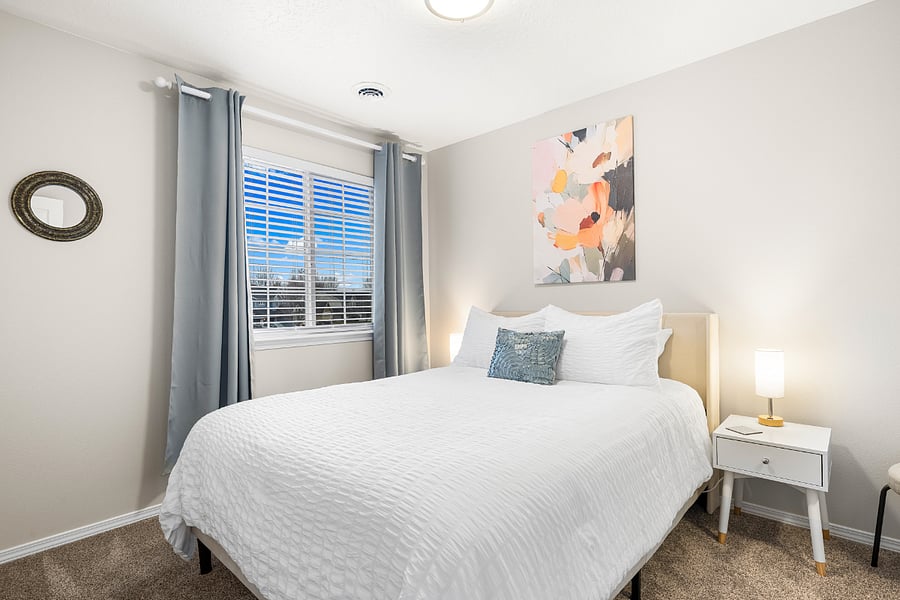 Luxury Saatva RX Queen Bed with walk in closet, hangers, dresser, hamper, luggage rack and optional changing table and blackout curtains.