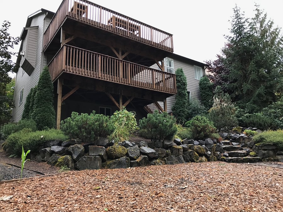 View from the backyard to both private decks.  This unit is the bottom deck.  Very private back here.
