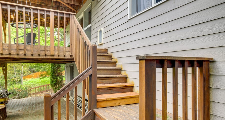 Stairs up to the unit's front door and private deck.