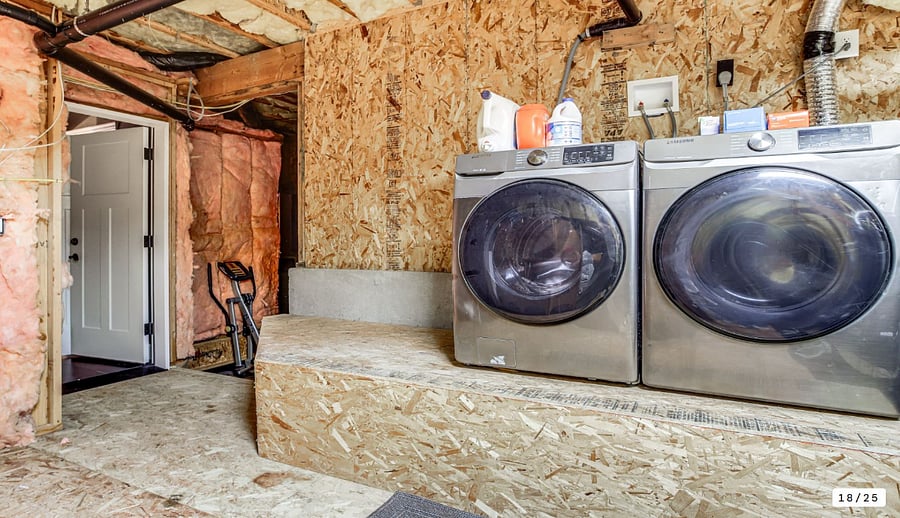The unit has its own washer /dryer.  The owner stores some household items to the left in this storage room.