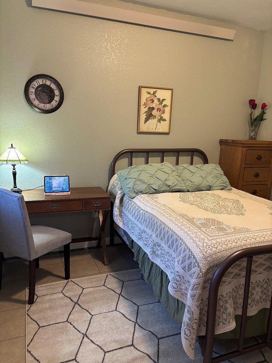Bedroom with desk for work, double bed, and dresser