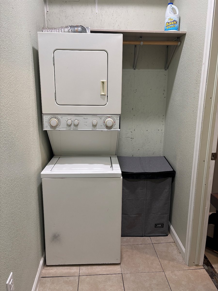 Stacked washer/dryer unit in closet