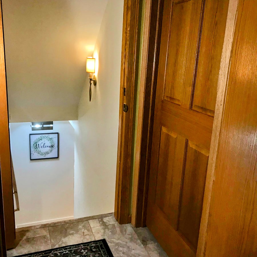The private lower level suite accessed from the mudroom hallway - has a secure door with keyed entry