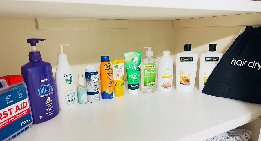 Bathroom essentials provided for your convenience, including shampoo, conditioner, body wash, lotion, sunscreen, lint roller, first aid supplies, and a hair dryer to help you feel right at home.