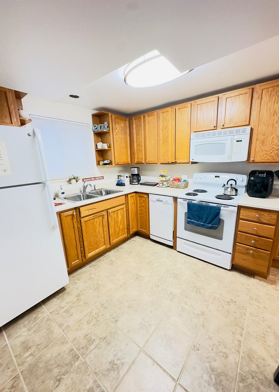 Enjoy a fully equipped kitchen with a fridge, stove, oven, microwave, dishwasher, blender, coffee and espresso maker. Stocked with cookware, air fryer, utensils, dishes, and condiments perfect for cooking meals and feeling right at home.