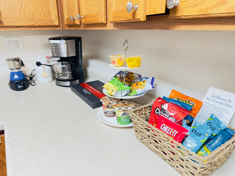 Enjoy a cozy kitchen stocked with a coffee station, tea options, and light breakfast items. A welcome snack basket is provided with treats to help you settle in and start your mornings with ease and comfort.