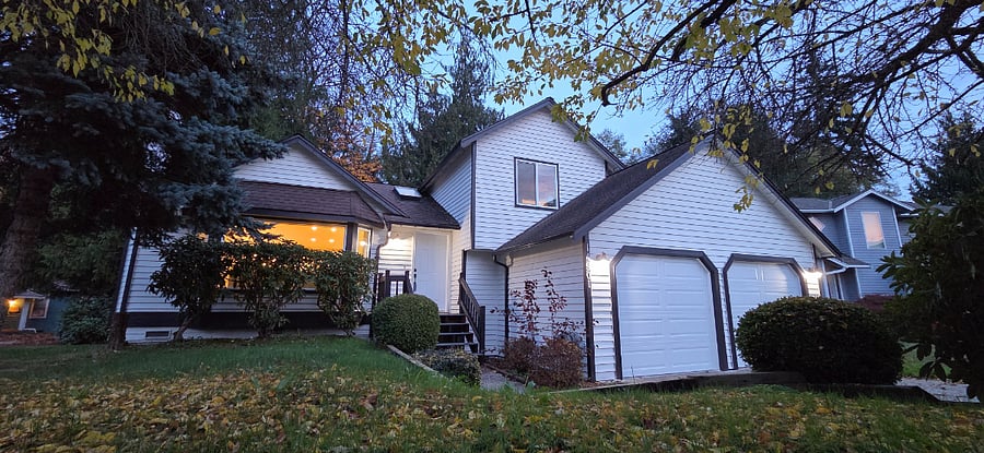 bright paved entryway and 2 car garage