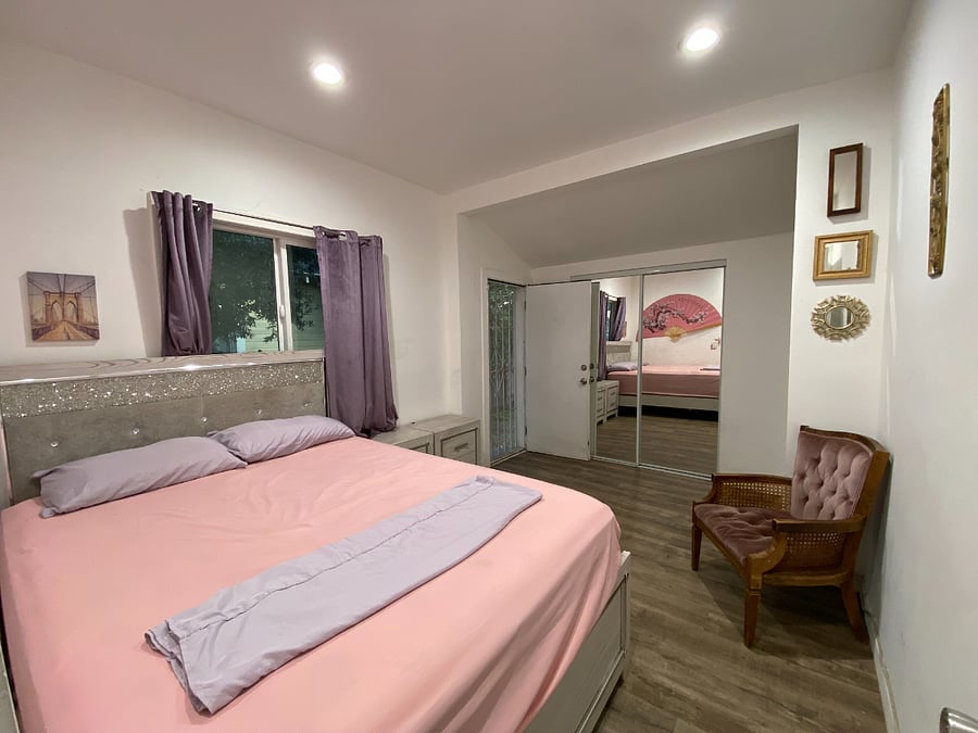 Bedroom with Queen size Bed, 2 huge nightstands, and a walk in closet 