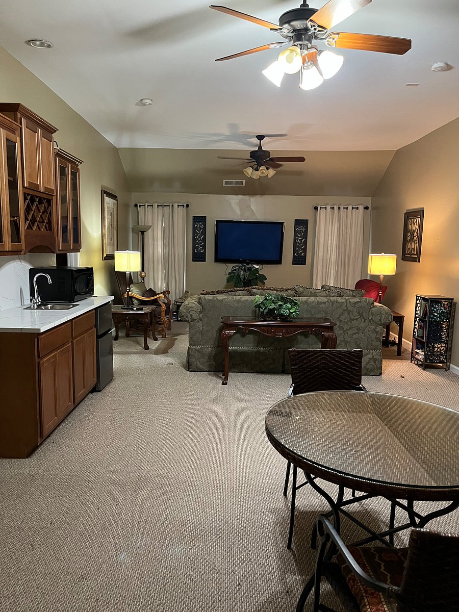 Upstairs Family/Theater/ Study Area with a wet bar, sink, microwave, under counter refrigerator, separate wine cooler refrigerator. Located next to laundry room which includes a linen closet, new washer and dryer.