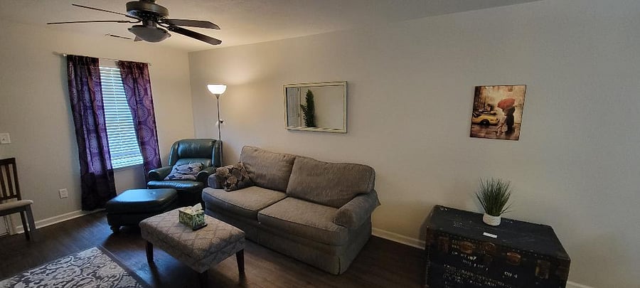 Nice living room area with a large tv on the wall