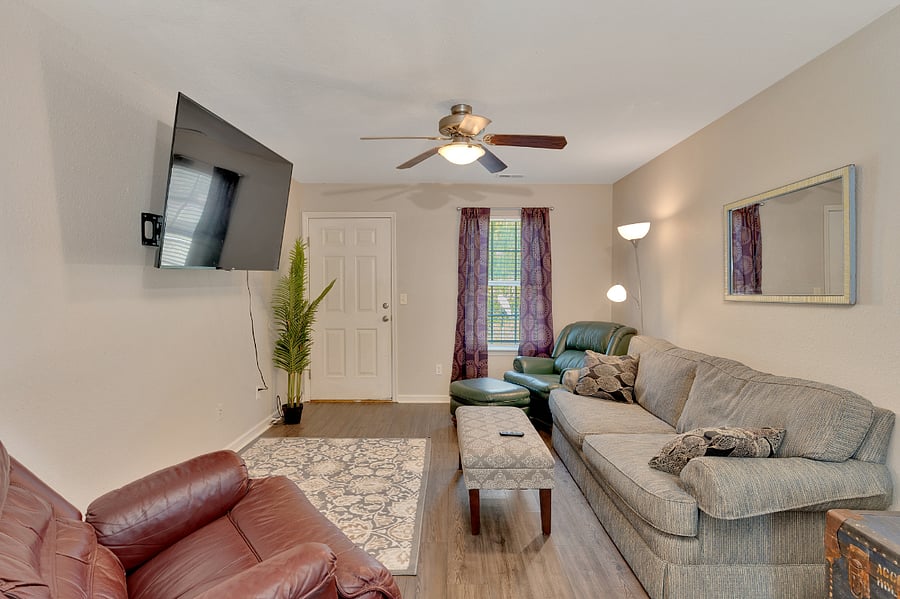 Nice living room area with a large tv on the wall