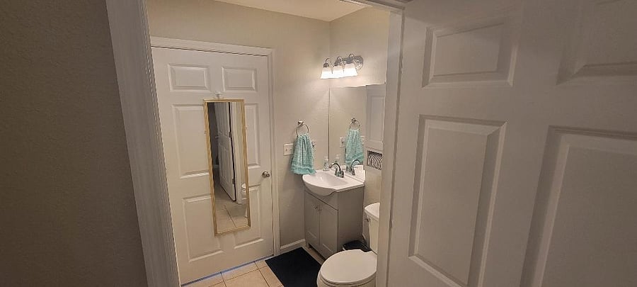 View of bathroom from inside the laundry room