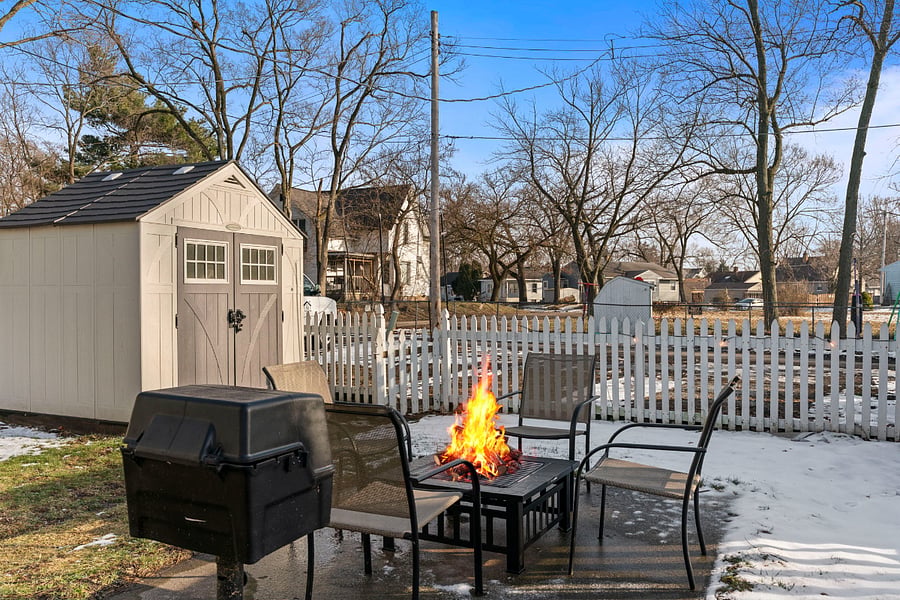 Super cozy, well lit backyard with outdoor seating and firepit. Firewood is provided!