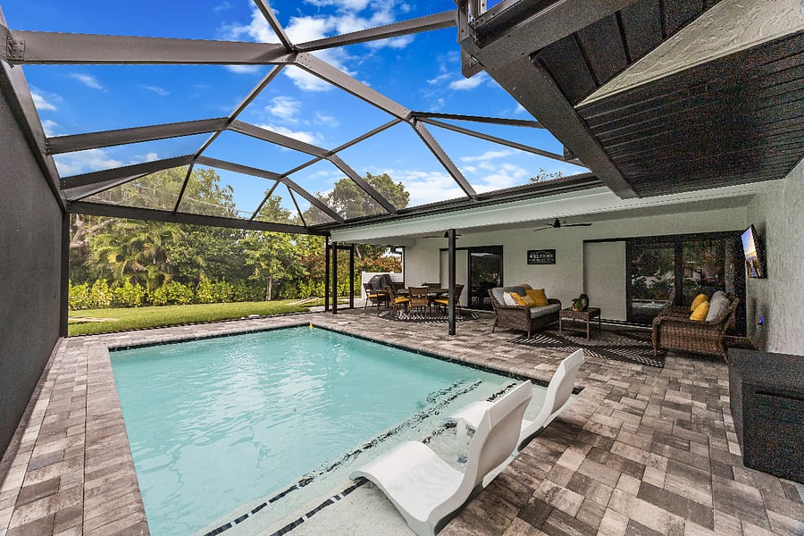 Soak up the sun from in-water loungers or kick back in the shaded outdoor living area with comfy seating and dining space for effortless indoor-outdoor living.