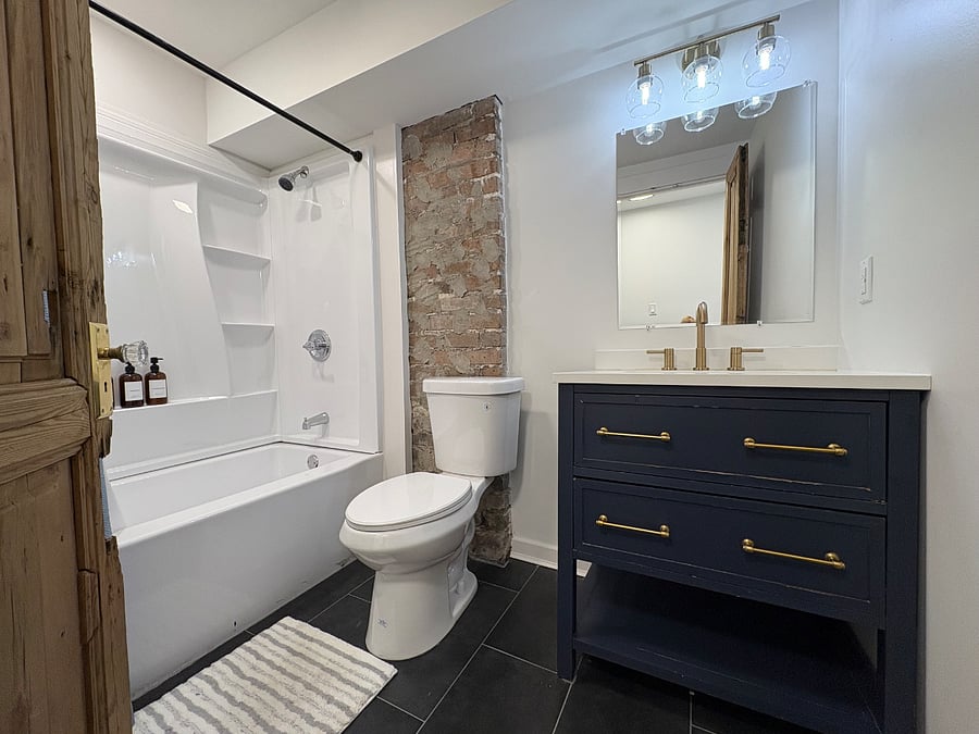 Bathroom 2: located in the rear of the unit off of the kitchen and king bedroom.