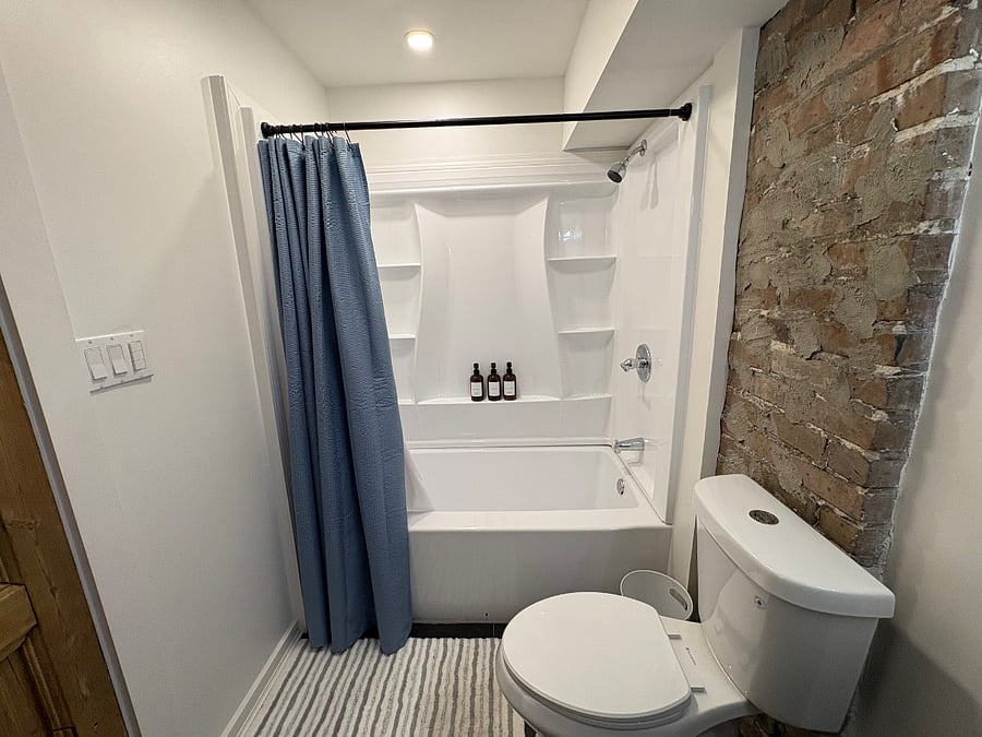 Bathroom 2: located in the rear of the unit off of the kitchen and king bedroom.