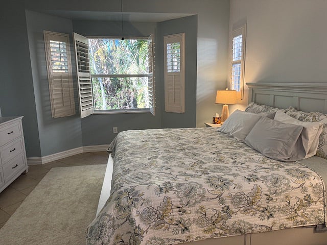 The master suite is truly luxurious. King size bed, dresser and great view of nature to wake up to.
