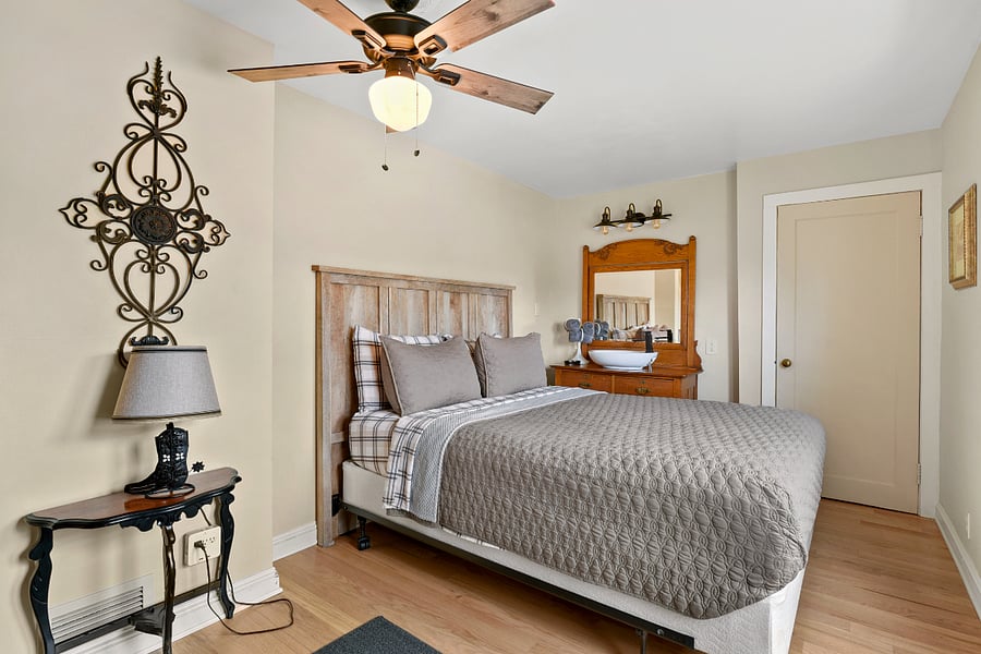 #2 bedroom with 2 closets, view, and vanity sink