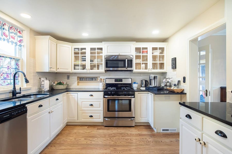 The kitchen has a gas stove, full-sized refrigerator, all plates, silverware, and cookware are included. 