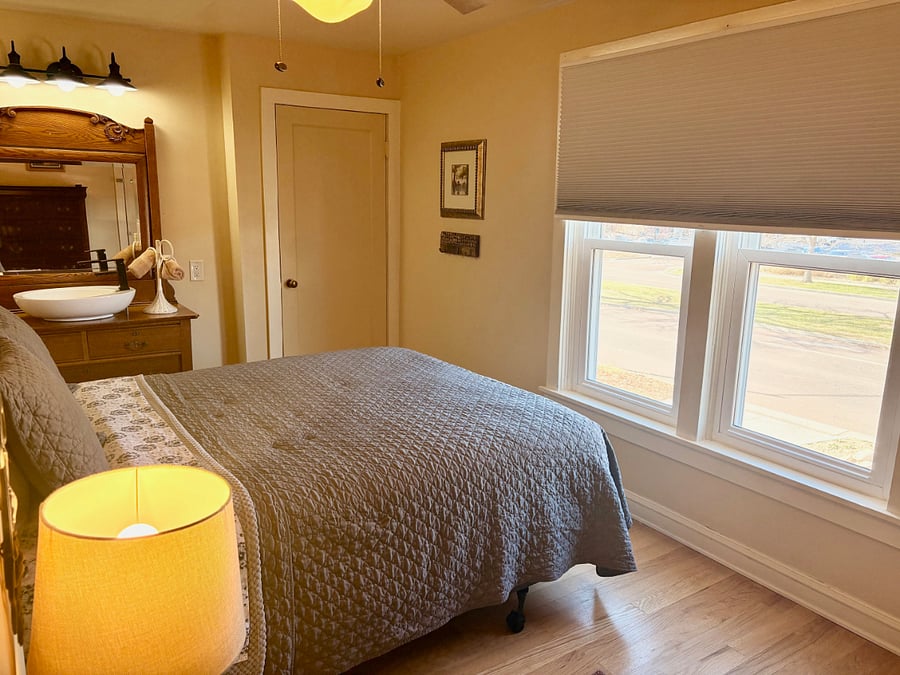 queen bedroom #2 features a city view, Pikes Peak view, 2 closets (one is locked with supplies), vanity and sink, black-out shades. 