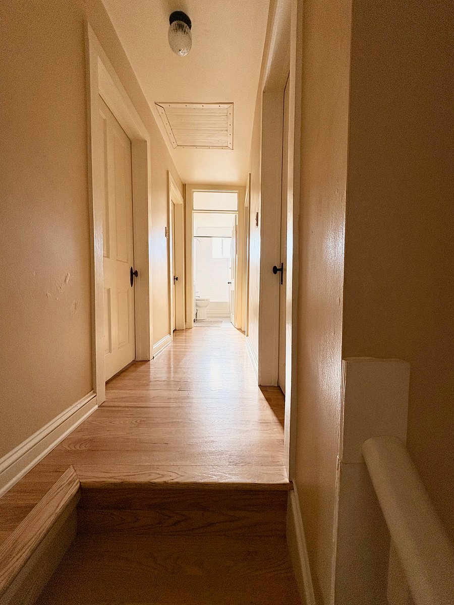 upstairs hallway leading to the full bathroom and the three doorways into the bedrooms. Also a linen closet with at entrance to the bathroom. 
