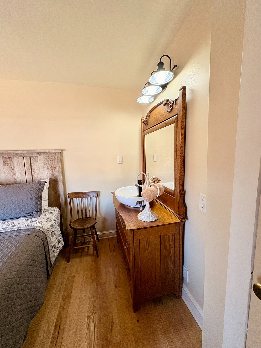 #2 queen bedroom with a sink vanity and extra storage. 