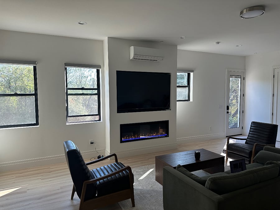 Windows have zebra shades and the entrance door is 8ft tall, glass, and has blinds for privacy.