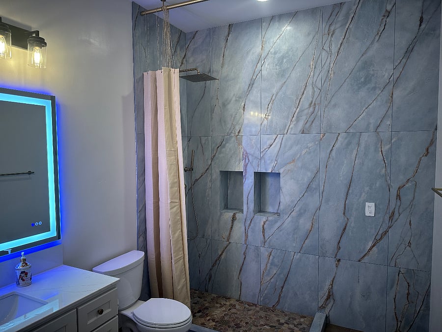 Bathroom also has 10ft high ceilings and huge shower powered by a tankless water heater for endless hot water.
