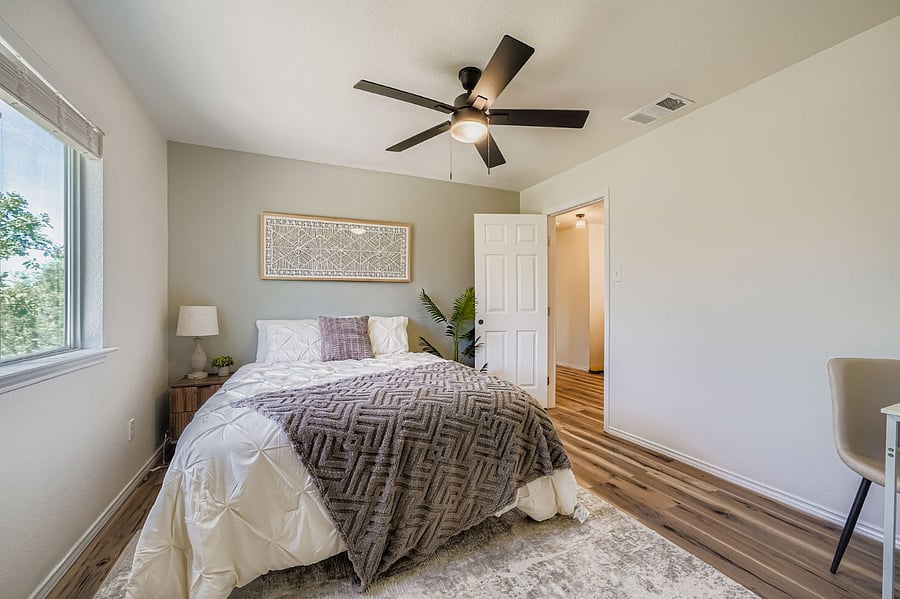 Comfortable private room facing the spacious backyard with queen bed and workstation