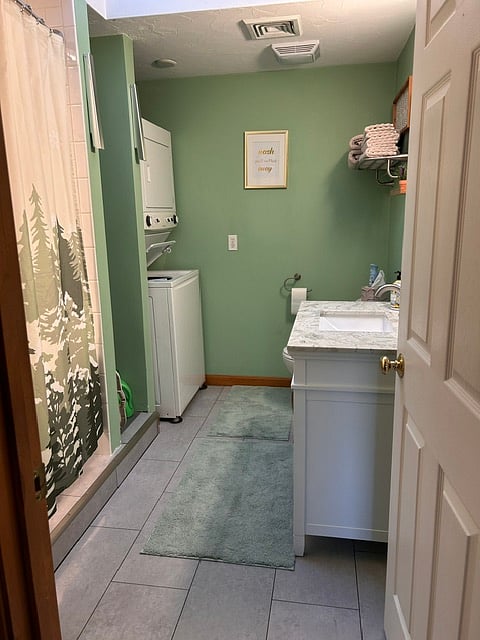Roomy bathroom with laundry. 