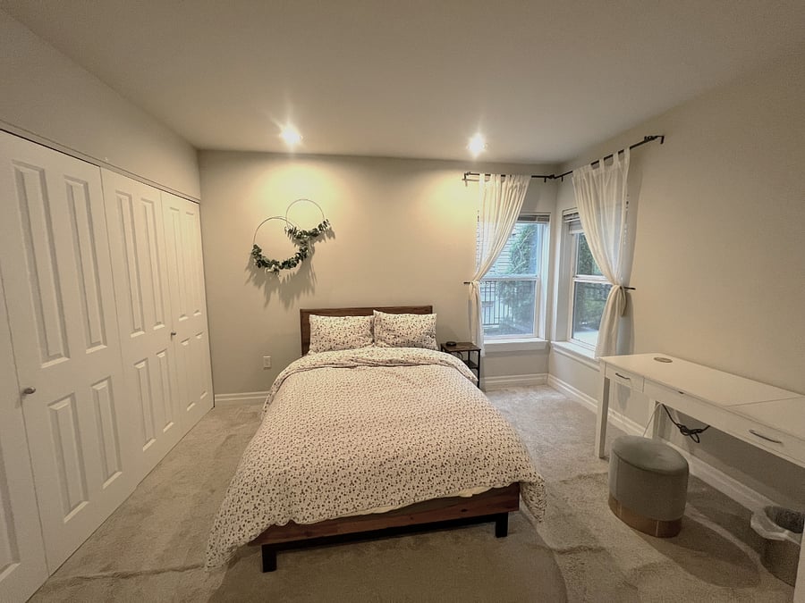 Bedroom 1 includes Full sized bed, bedside table, black out shades, large closet, and desk w/ flip top mirror 