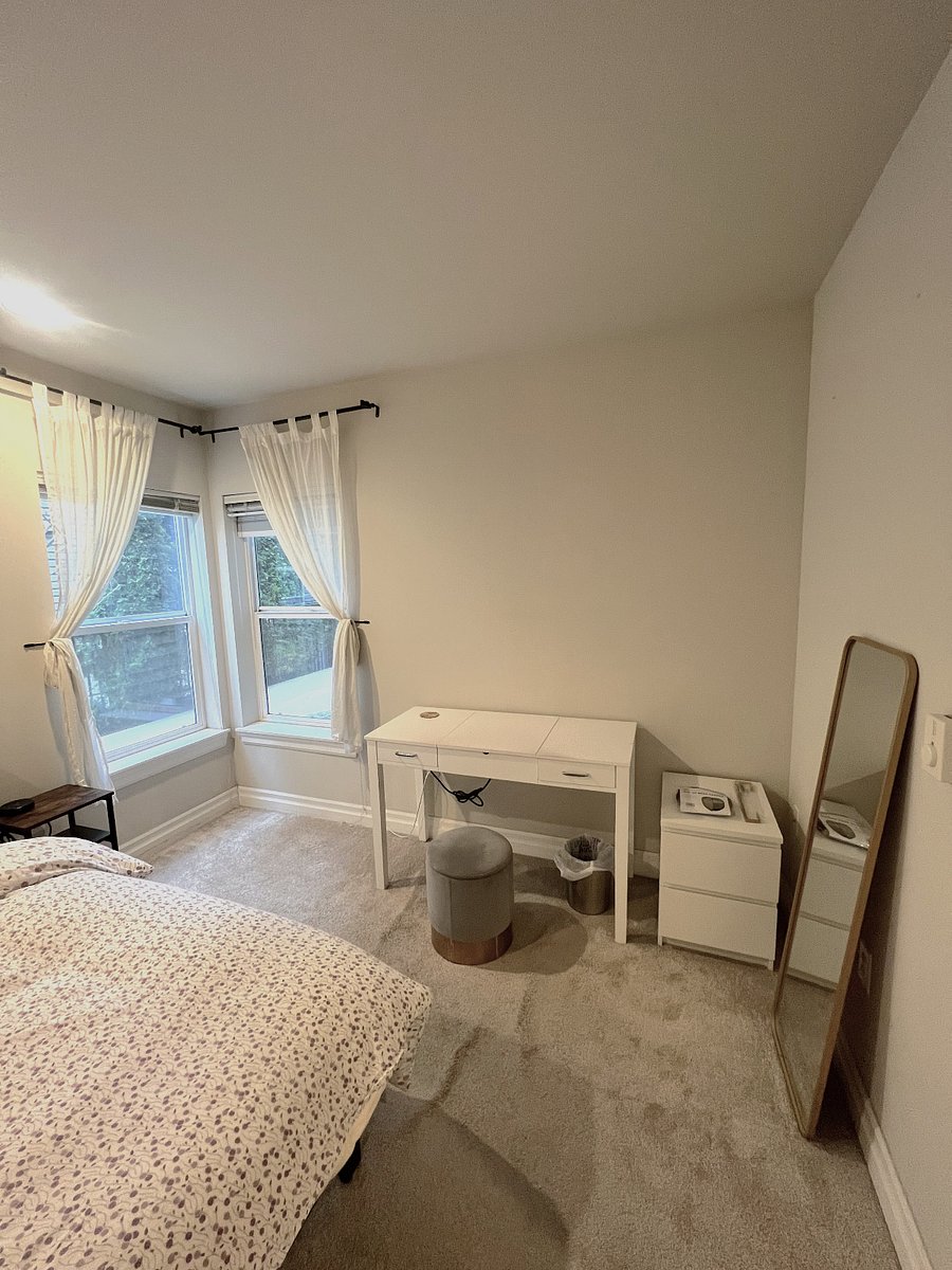 Bedroom 1 includes full length mirror and small 2-drawer chest. Ottoman chair also has removable lid for storage. 