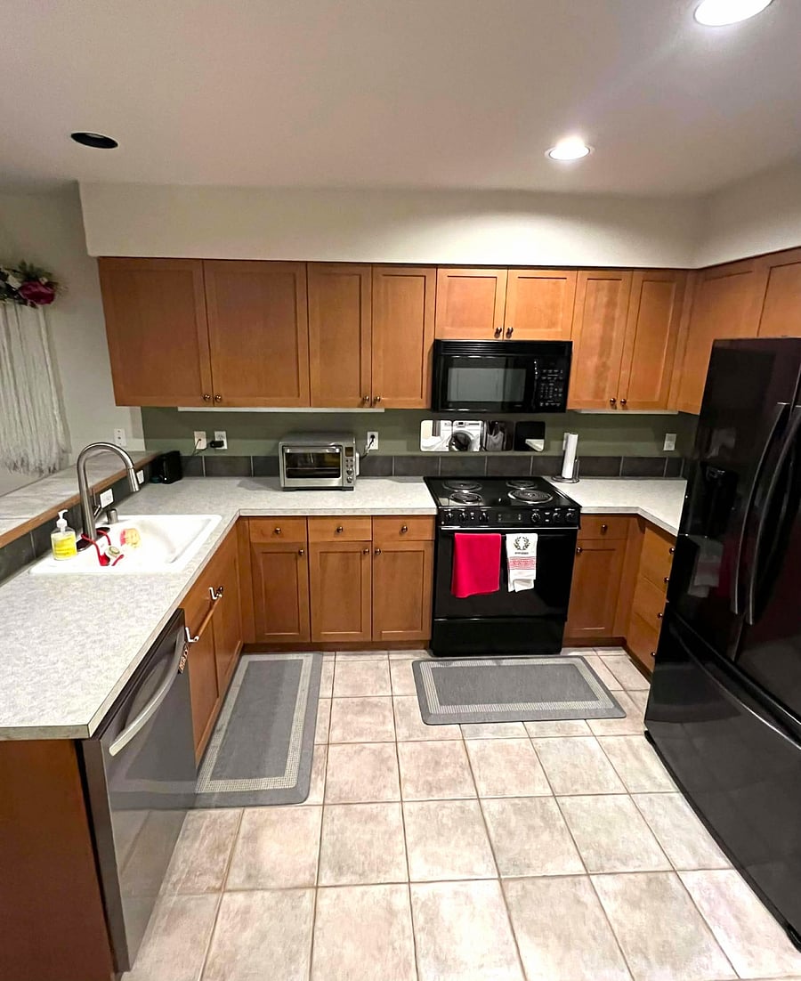 Kitchen with utensils, pots/pans, plates, bowls, and cups 