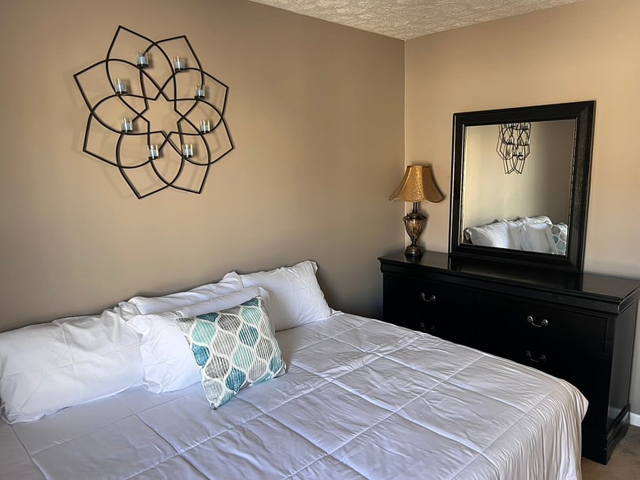 third bedroom closet six drawer dresser with mirror