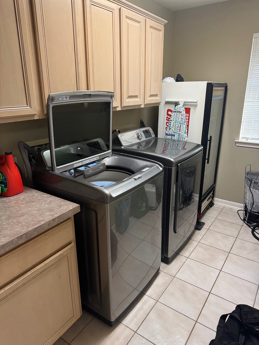 Indoor, large capacity washer and dryer, as well as second refrigerator.