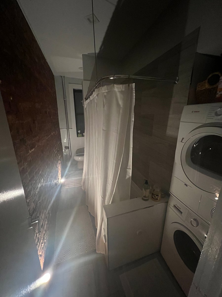 Mood lighting in bathroom for relaxing bath time.
