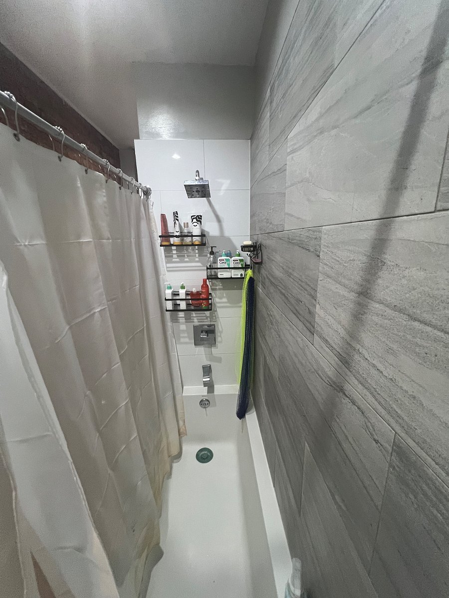 Large deep bathtub which is rare in NYC.