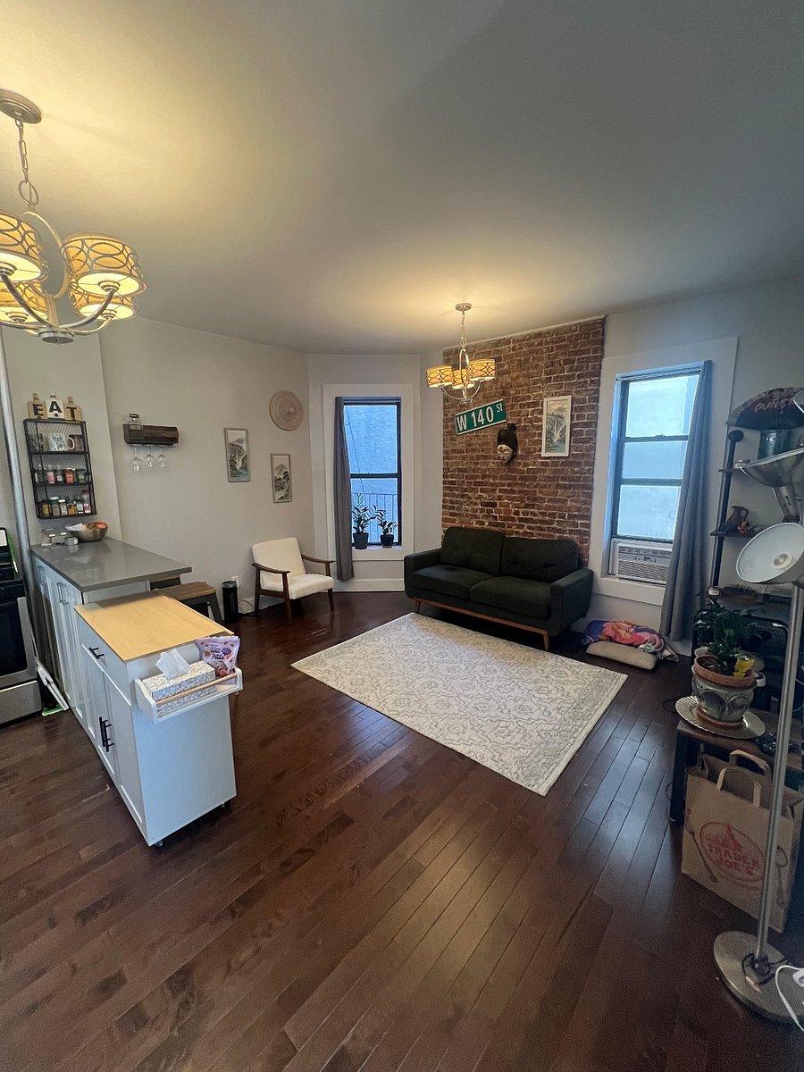 Comfortable living room with exposed brick.