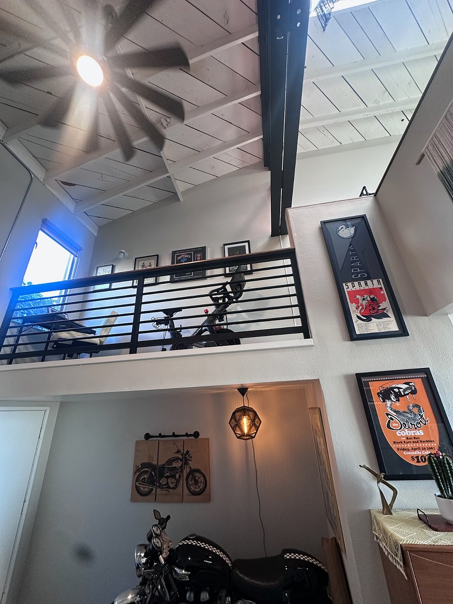 Work station with cushion roller chair and peleton bike